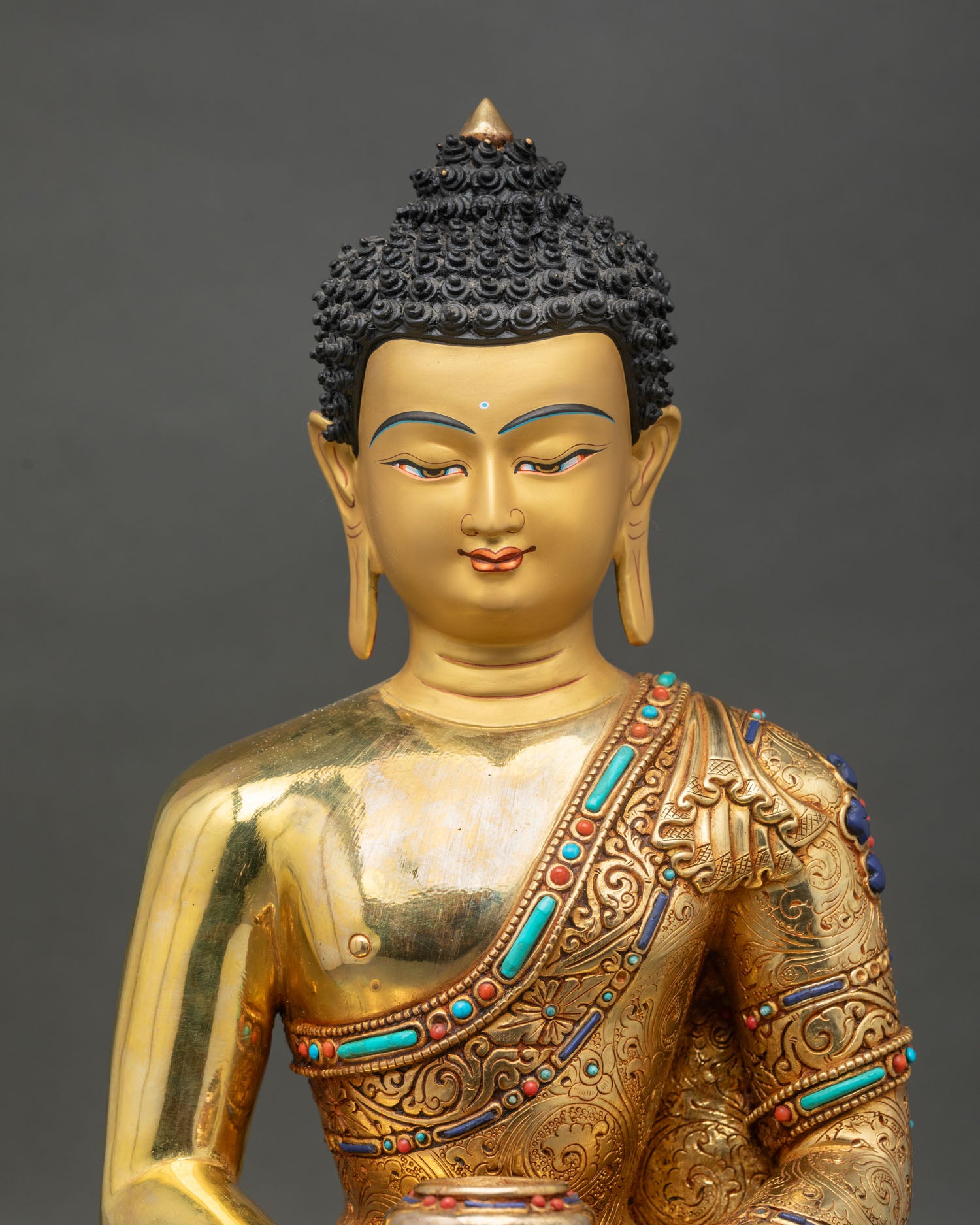 Regular close-up of Amitabha Buddha statue, detailed copper and gold craftsmanship