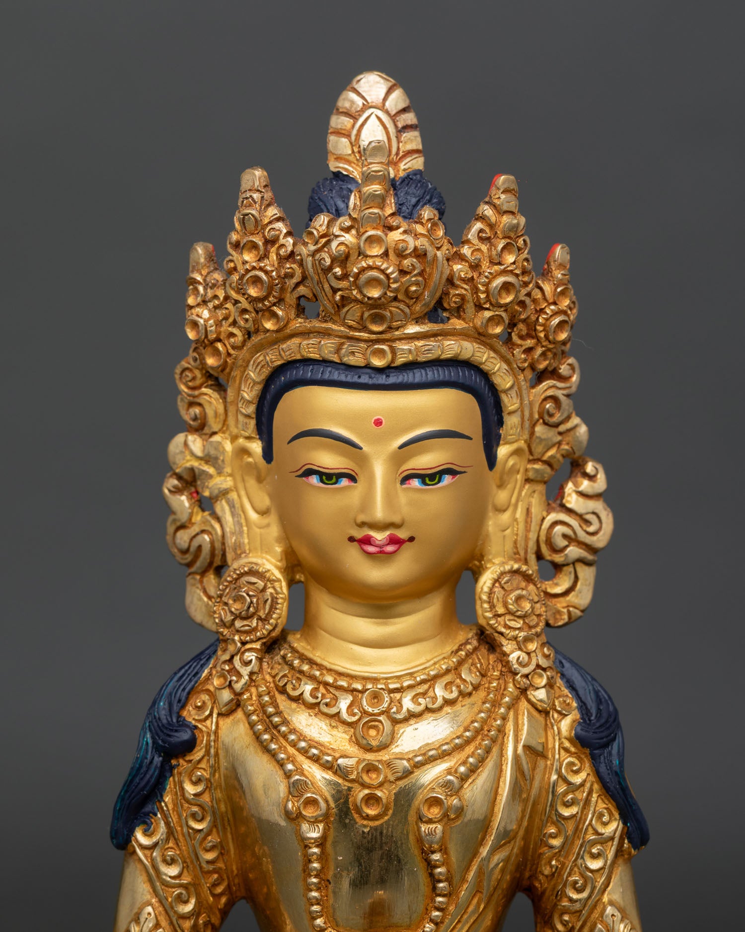regular close up of amitayus statue handcrafted copper buddhist artwork with gold gilded details