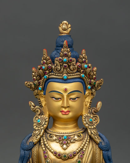 Regular close-up of Amitayus statue showing intricate copper and gold details