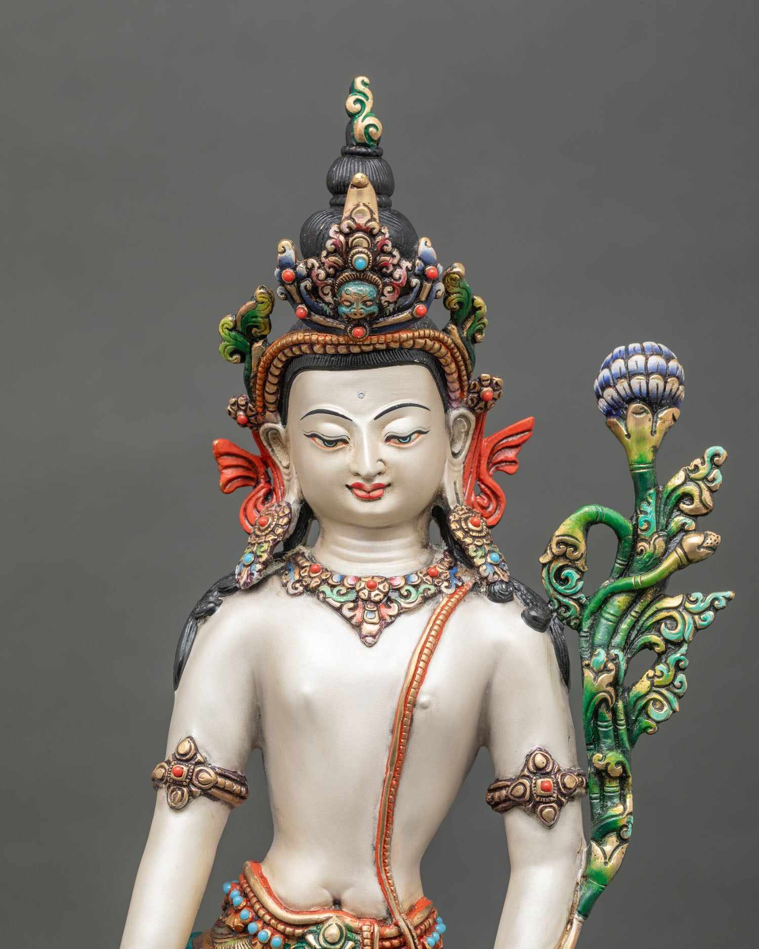 regular close up of chenrezig bodhisattva statue showing hand-painted details