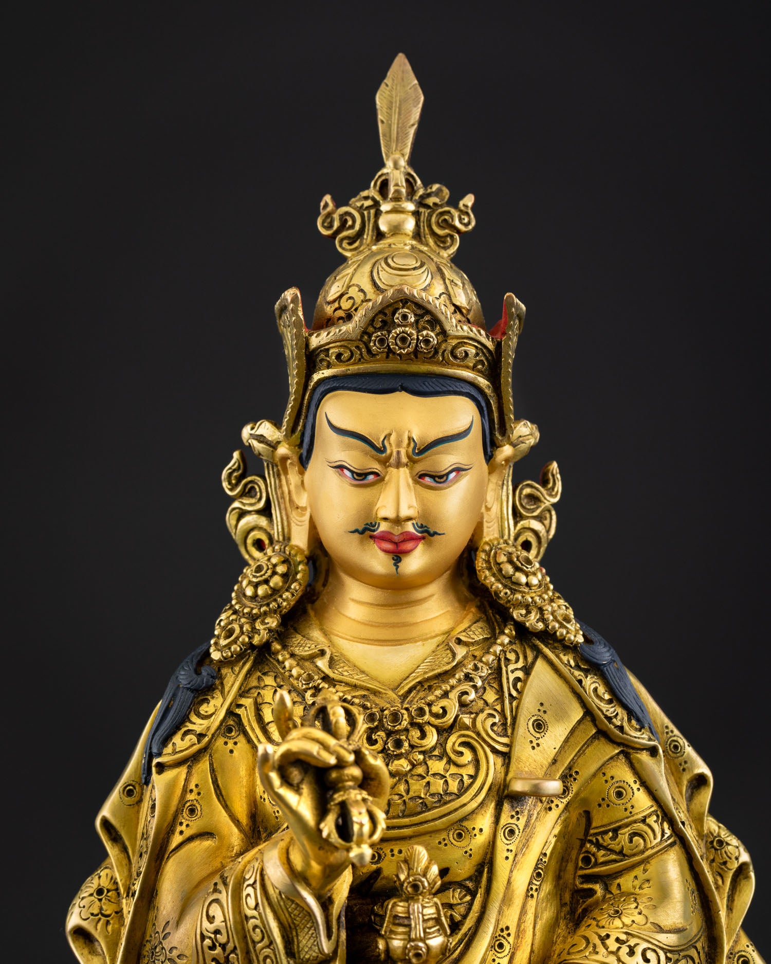 Regular close up of Guru Tsokye Dorje statue with gold fire-gilded copper details