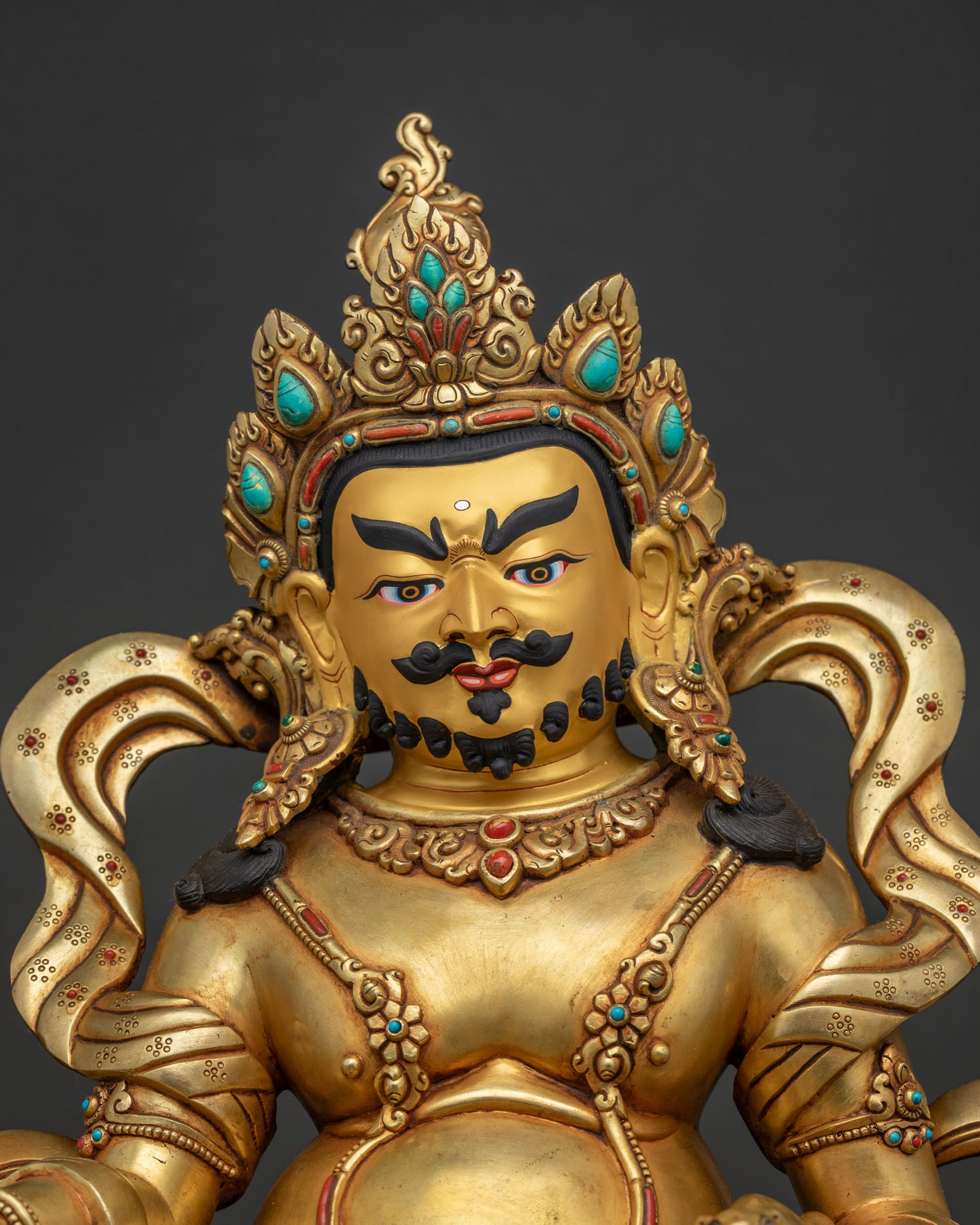 regular close up of handcrafted 24k gold gilded dzambhala buddhist statue