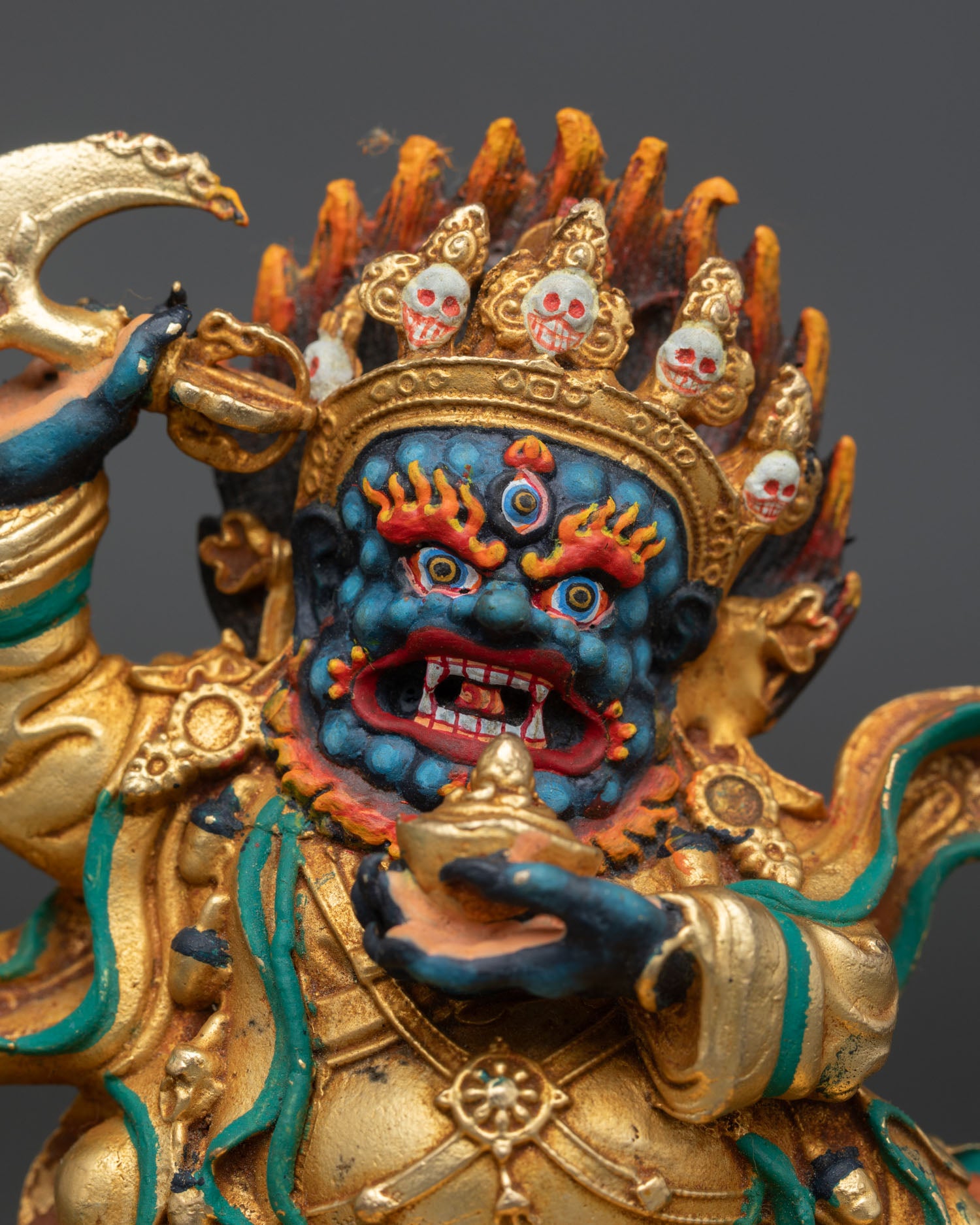 Regular close-up of Mahakala Bernagchen Statue showing gold-gilded copper detailing and sacred ornaments from Nepal