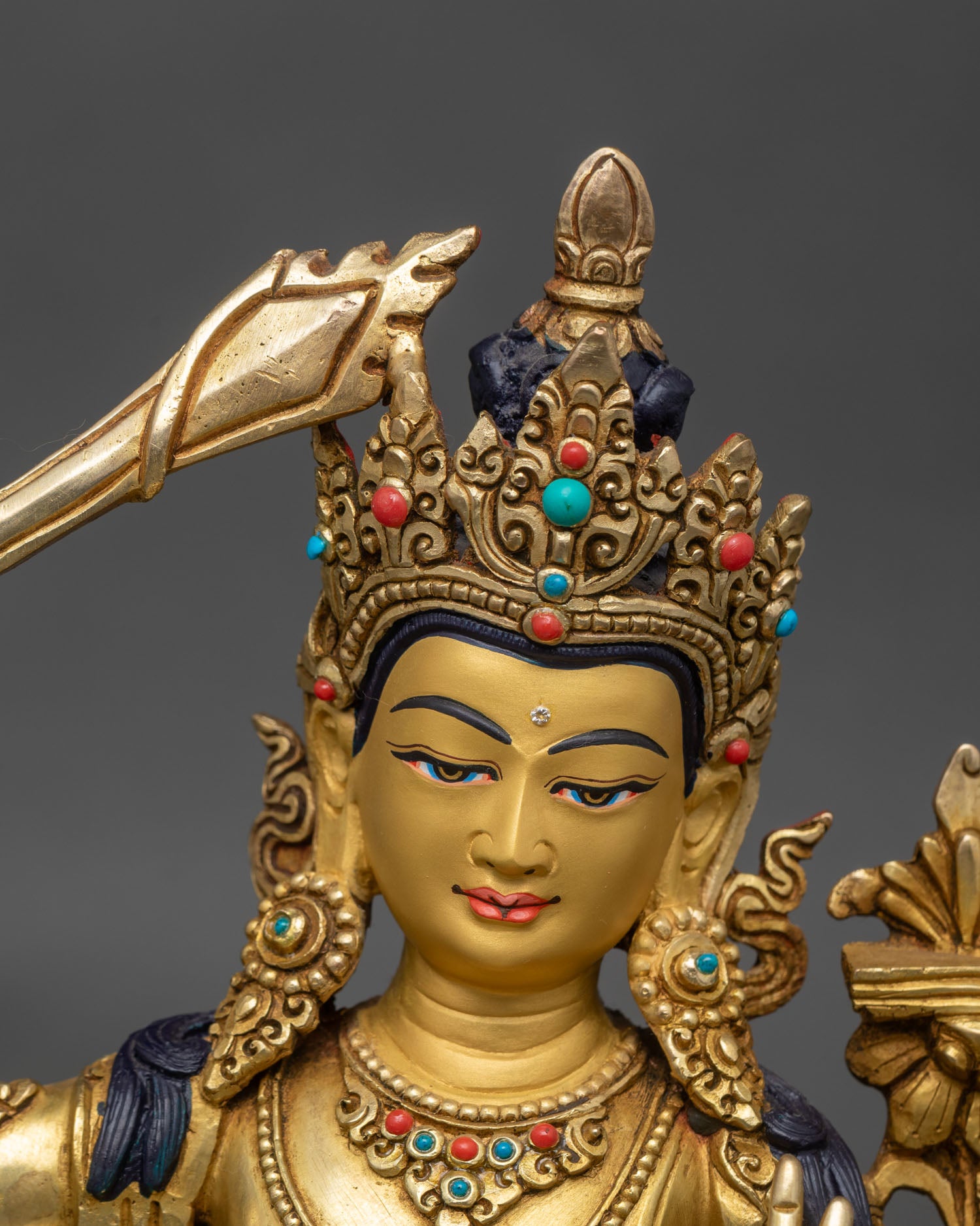 Detailed lost-wax copper and gold-gilded Buddhist deity art