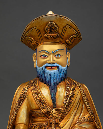 Close-up of Zhabdrung Ngawang Namgyal statue with gold-painted face and ornate monastic robes