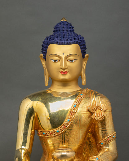 Regular close-up of Shakyamuni Buddha statue showing intricate gold and copper craftsmanship