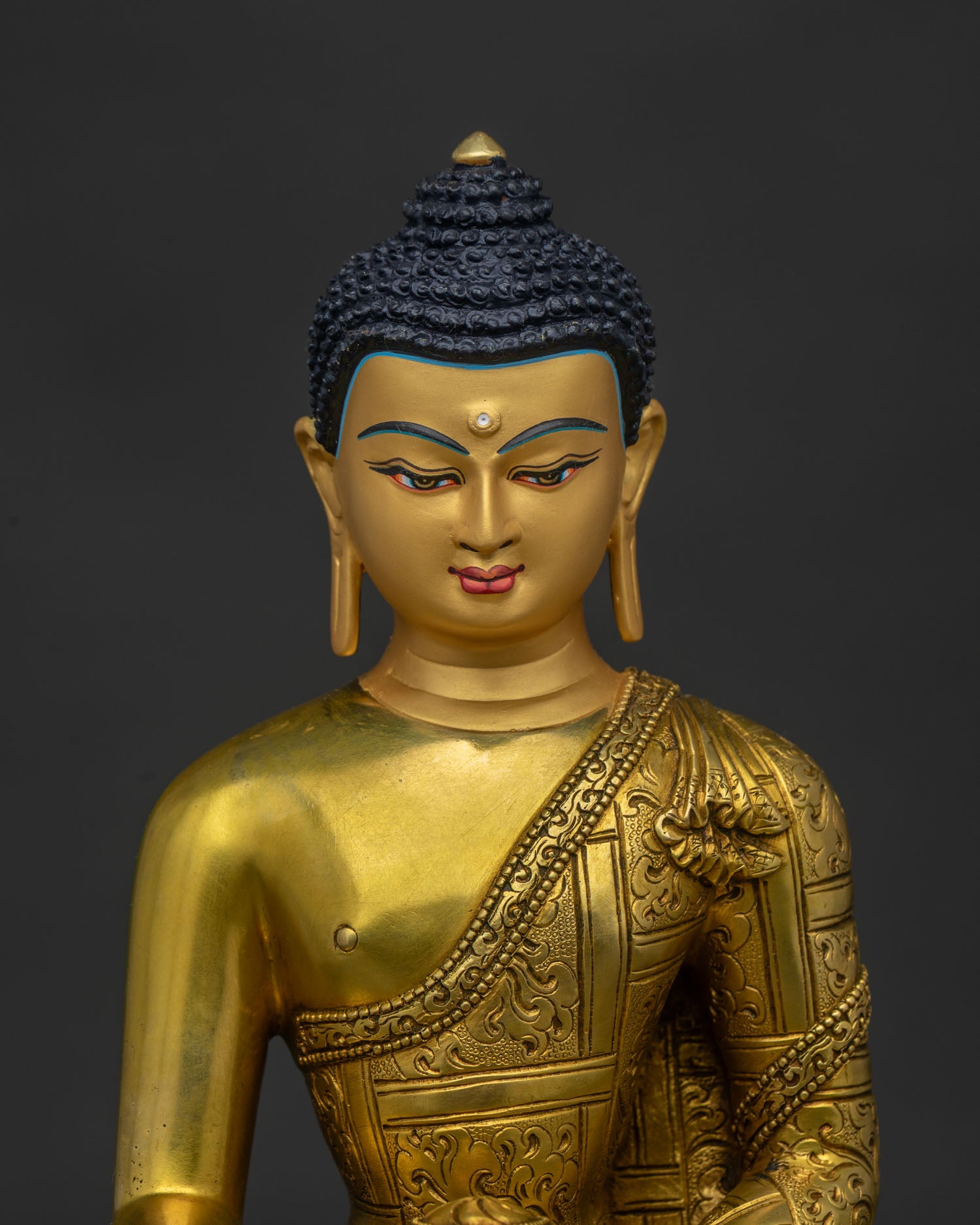 Regular close up of Shakyamuni Buddha Statue showing traditional Buddhist craftsmanship