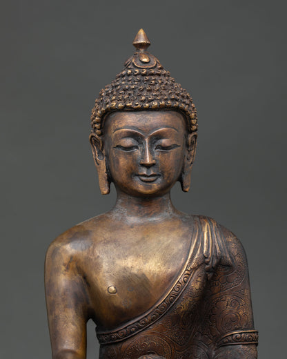 Regular close up of Shakyamuni Buddha statue with antique finish and handcrafted copper details