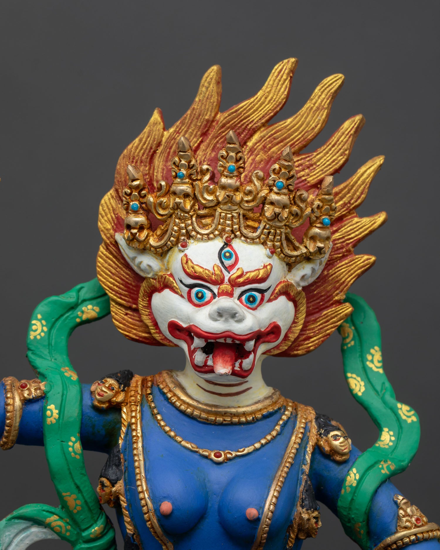 Regular close up of Simhamukha Statue showing wrathful lion face and lotus seat