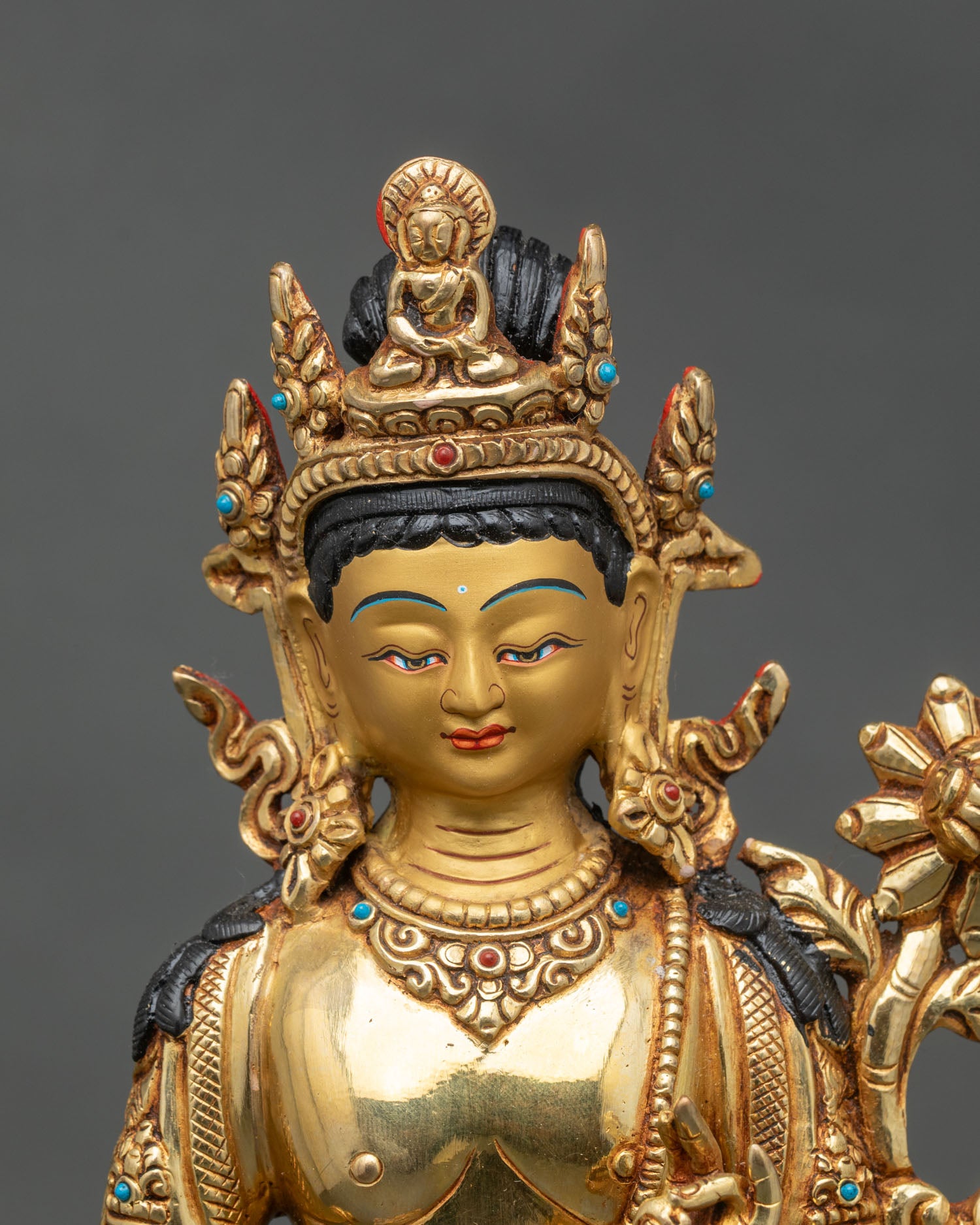 Regular close-up of Standing Chenrezig Bodhisattva, intricate gold and stone details