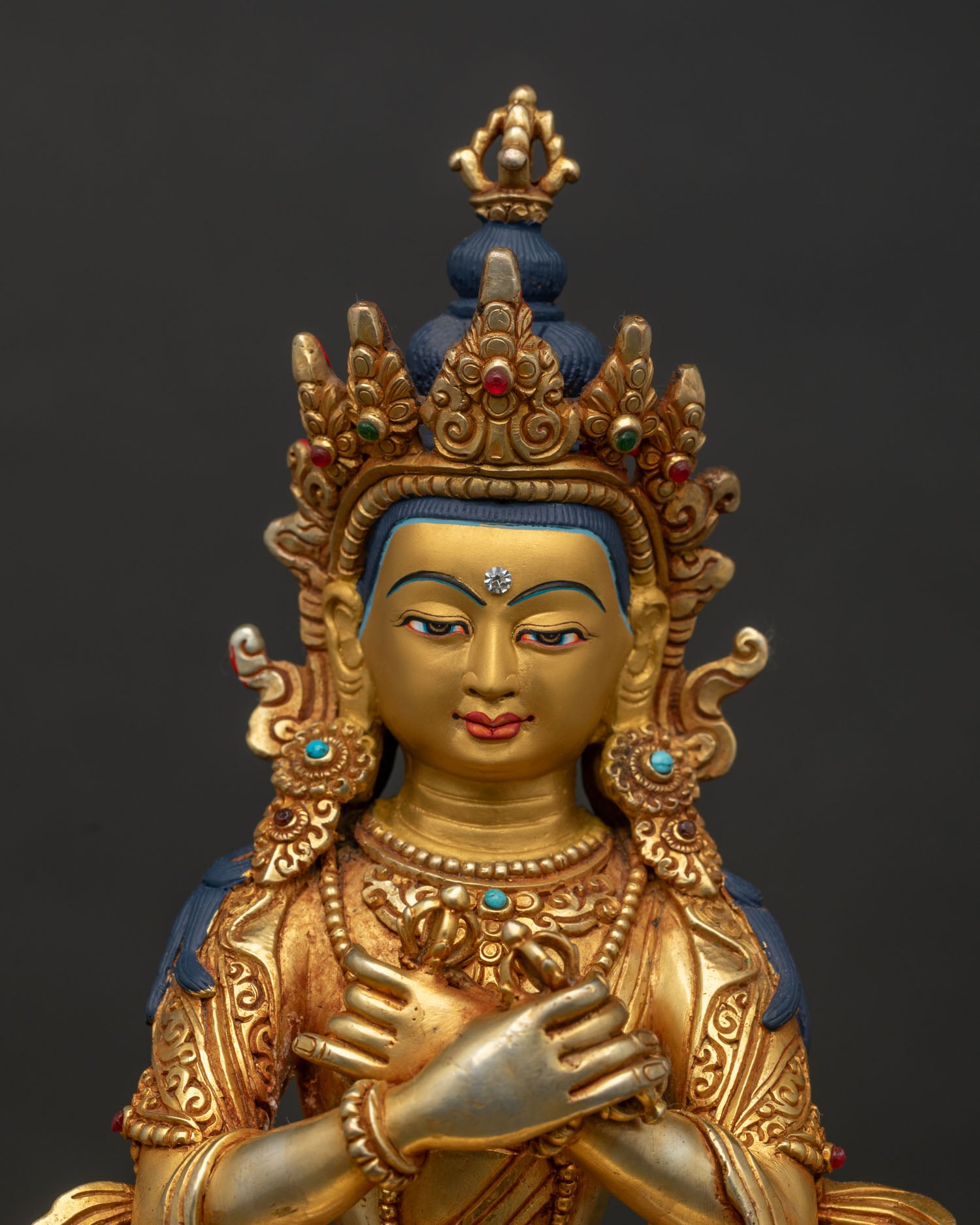 Regular close up of Vajradhara Statue with copper craftsmanship and sacred Buddhist details