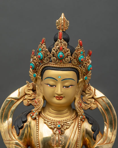 Regular close up of Vajrasattva Dorje Sempa statue showing flowing robes and serene gold face