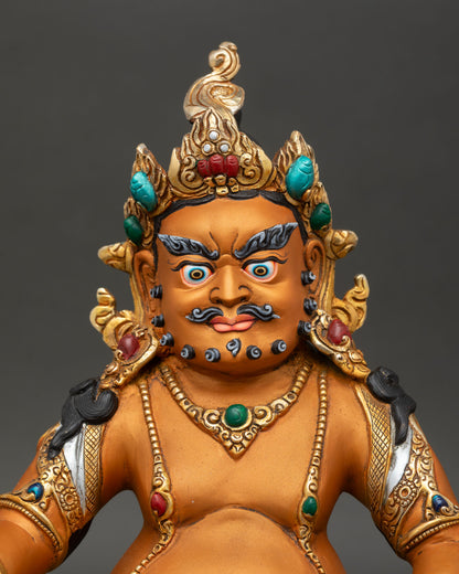 regular close up of yellow dzambhala statue hand painted copper statue with gold gilding semi precious stone details