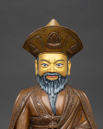 Regular close-up of zhabdrung rinpoche statue showing full figure and intricate iconography