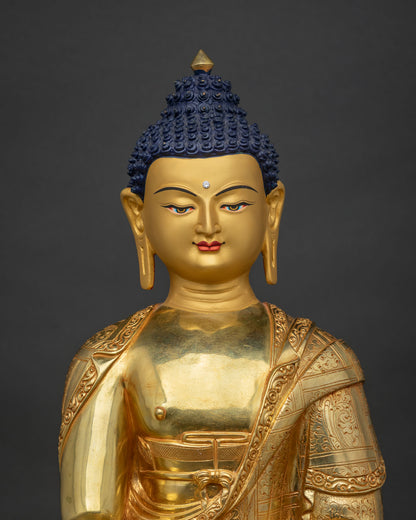 Shakyamuni Buddha copper statue close-up with gold gilding and lotus pedestal