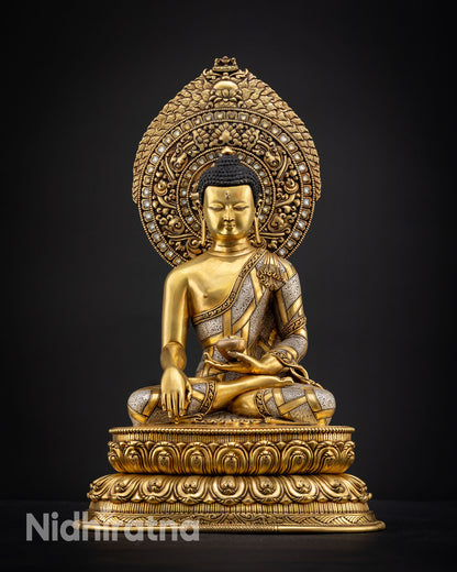 Regular close-up view of Shakyamuni Buddha statue with finely gold painted face and museum quality copper craftsmanship with sacred Vajrayana detailing