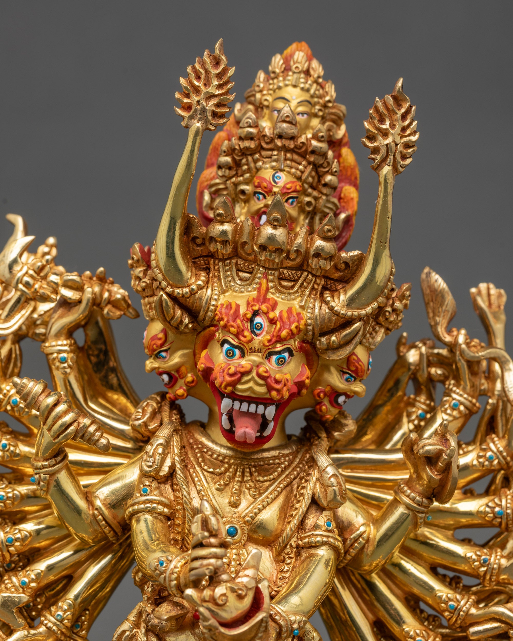 Regular close up view of Yamantaka Vajrabhairava sculpture showing nine heads and intricate tantric details