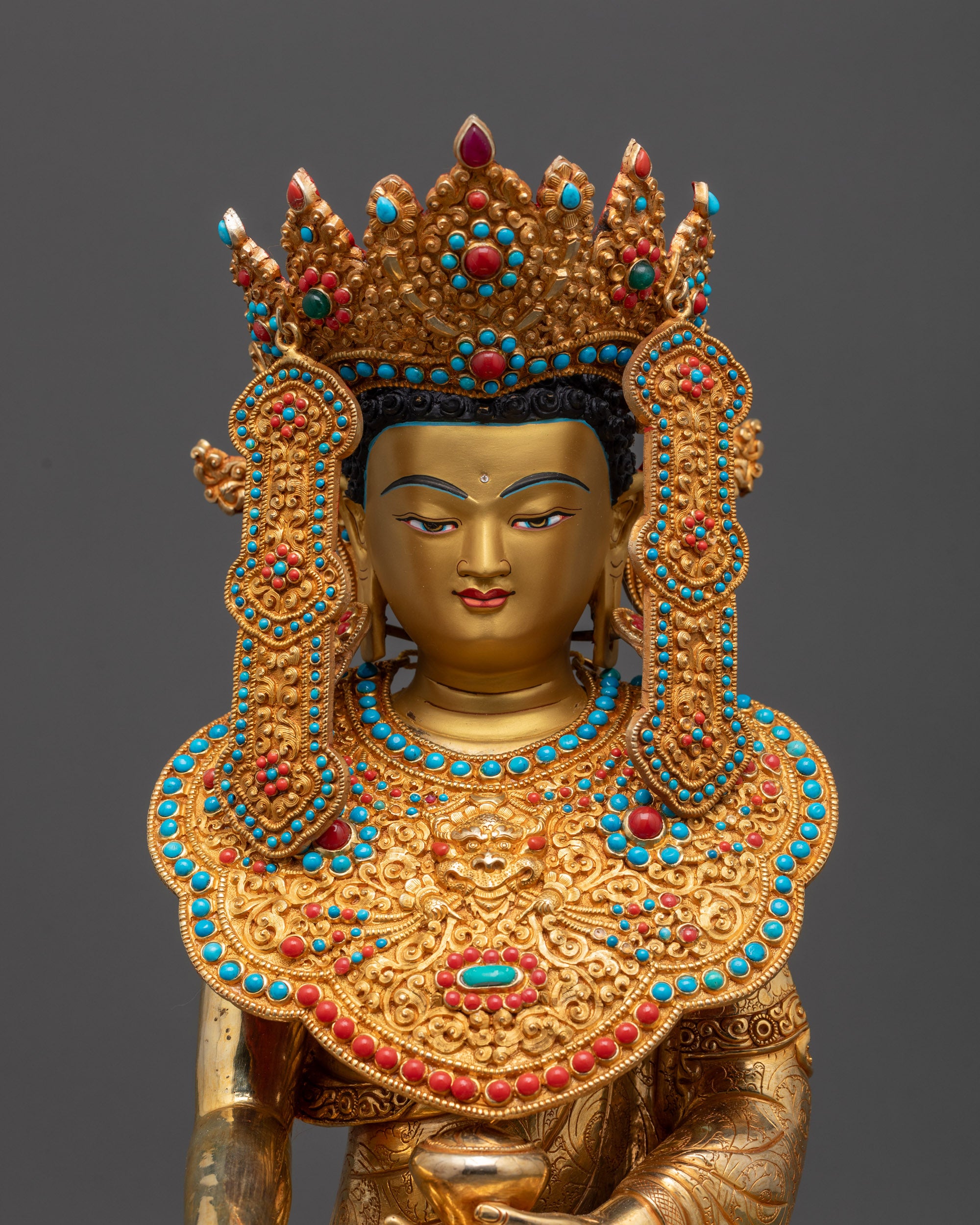 regular close up Jowo Rinpoche statue highlighting filigree jewelry and miniature Garuda motif