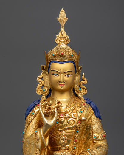 regular close up Tsokye Dorje statue showing lotus hat and kasaya robe motif details