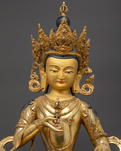 regular close up Vajrasattva statue showing crown, earrings, and robe details

