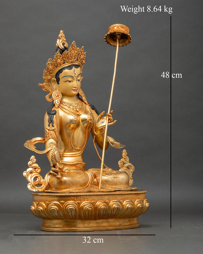 Right profile of Dukar statue, handcrafted Nepalese copper with fire-gilded accents