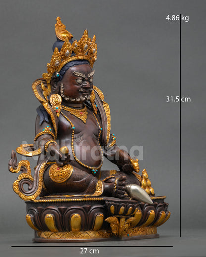 Right profile Dzambhala statue Himalayan sculpture holding mongoose and wish fulfilling jewel