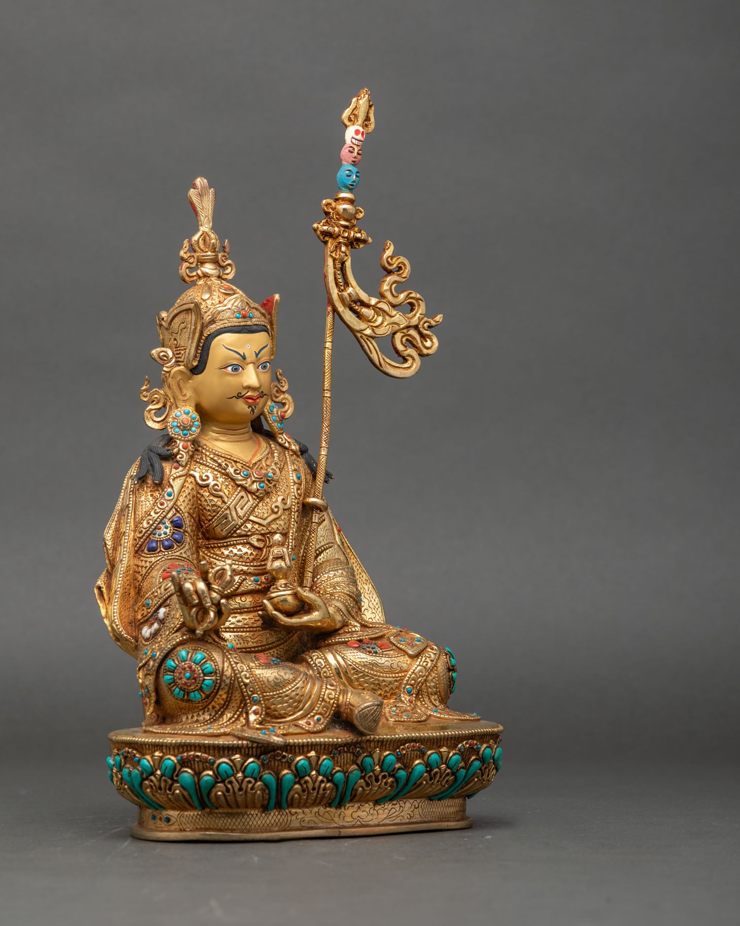 Right profile of Guru Rinpoche trio statue highlighting traditional Himalayan craftsmanship