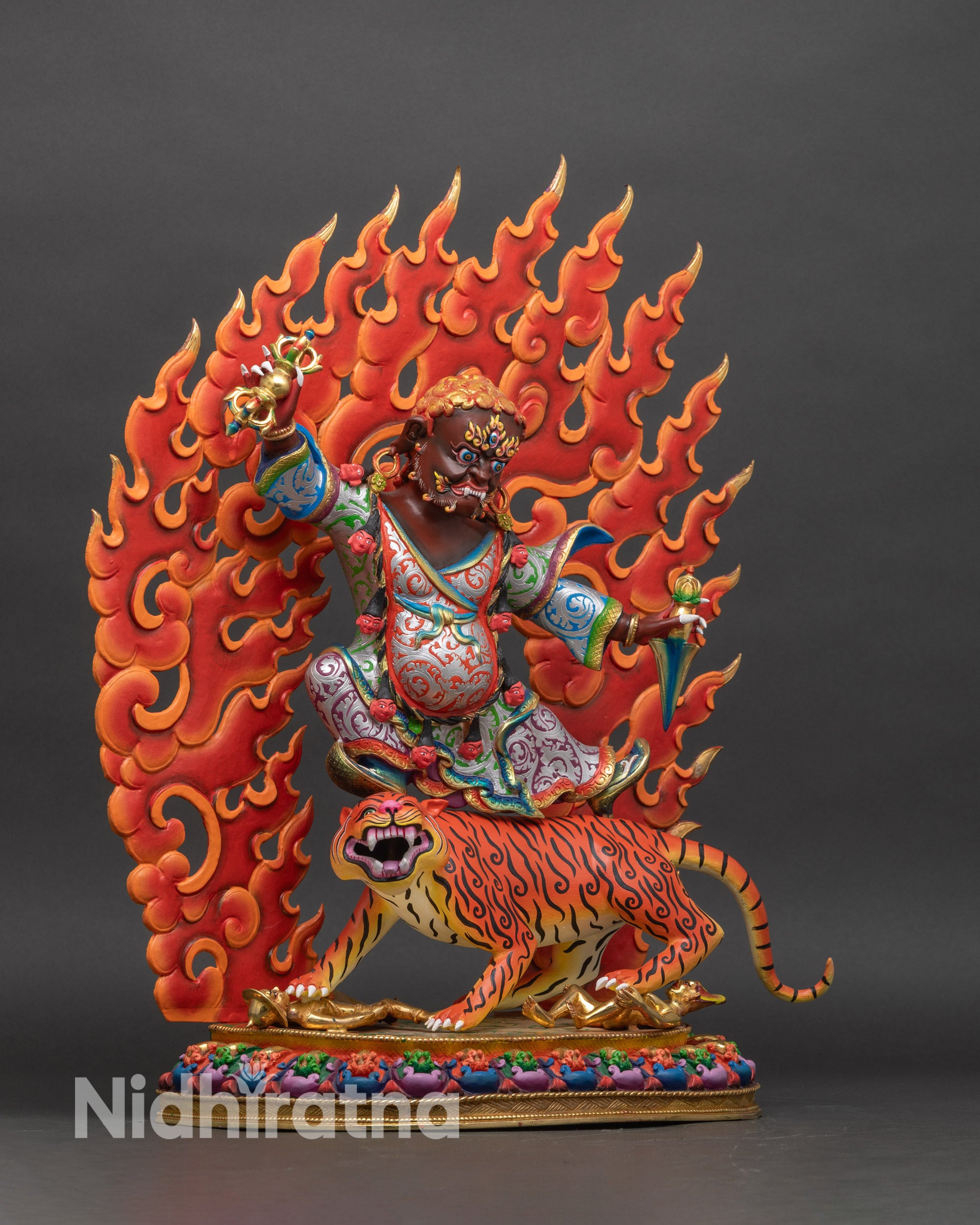 Right profile of Dorje Drolo statue on tigress, vibrant Himalayan Buddhist art