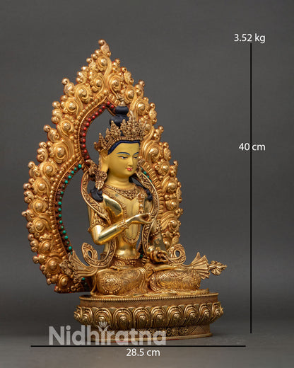 right profile of vajrasattva statue seated on lotus pedestal with intricate gold details