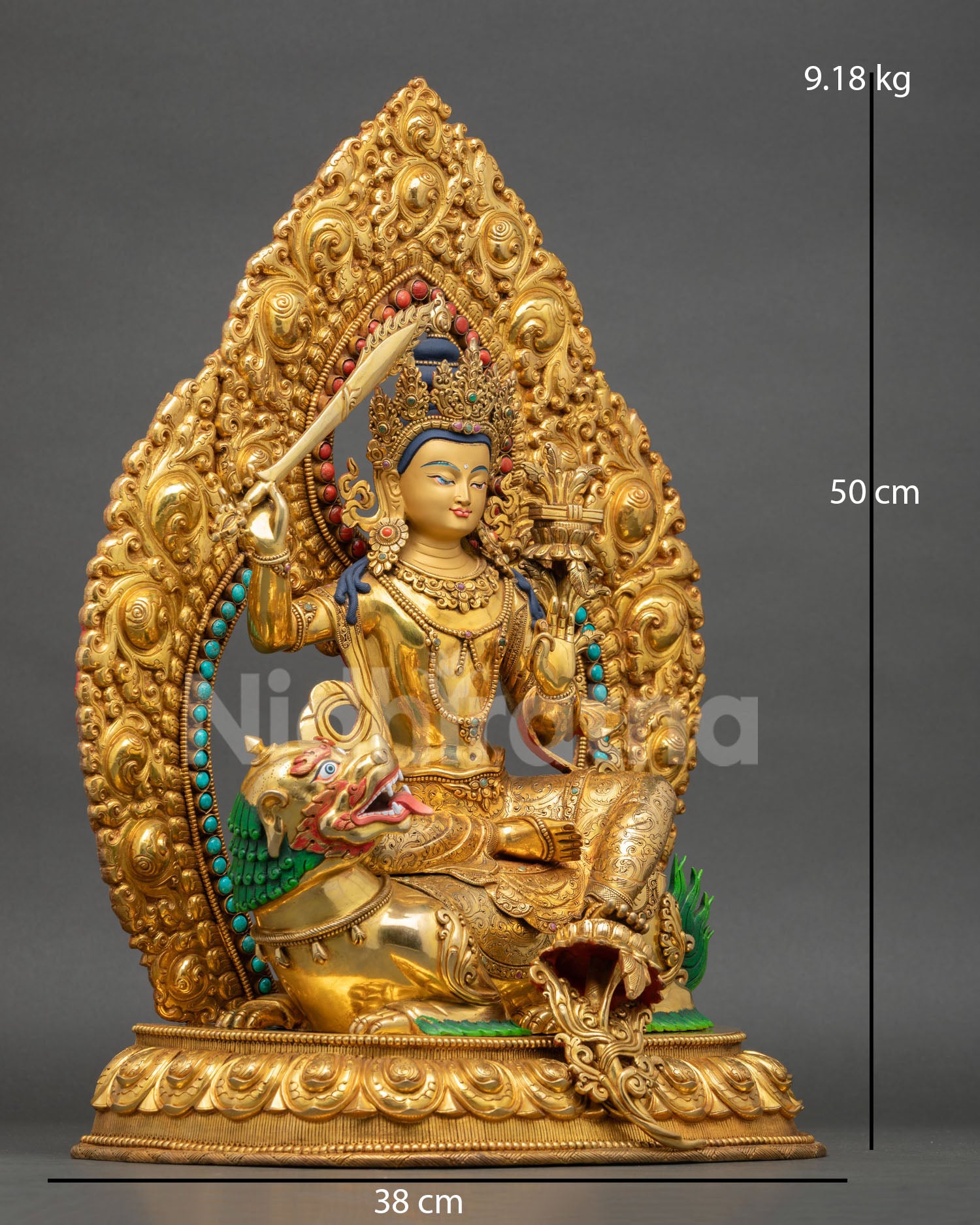 right profile view of lion riding manjushri statue, flowing robes and ritual sword detail