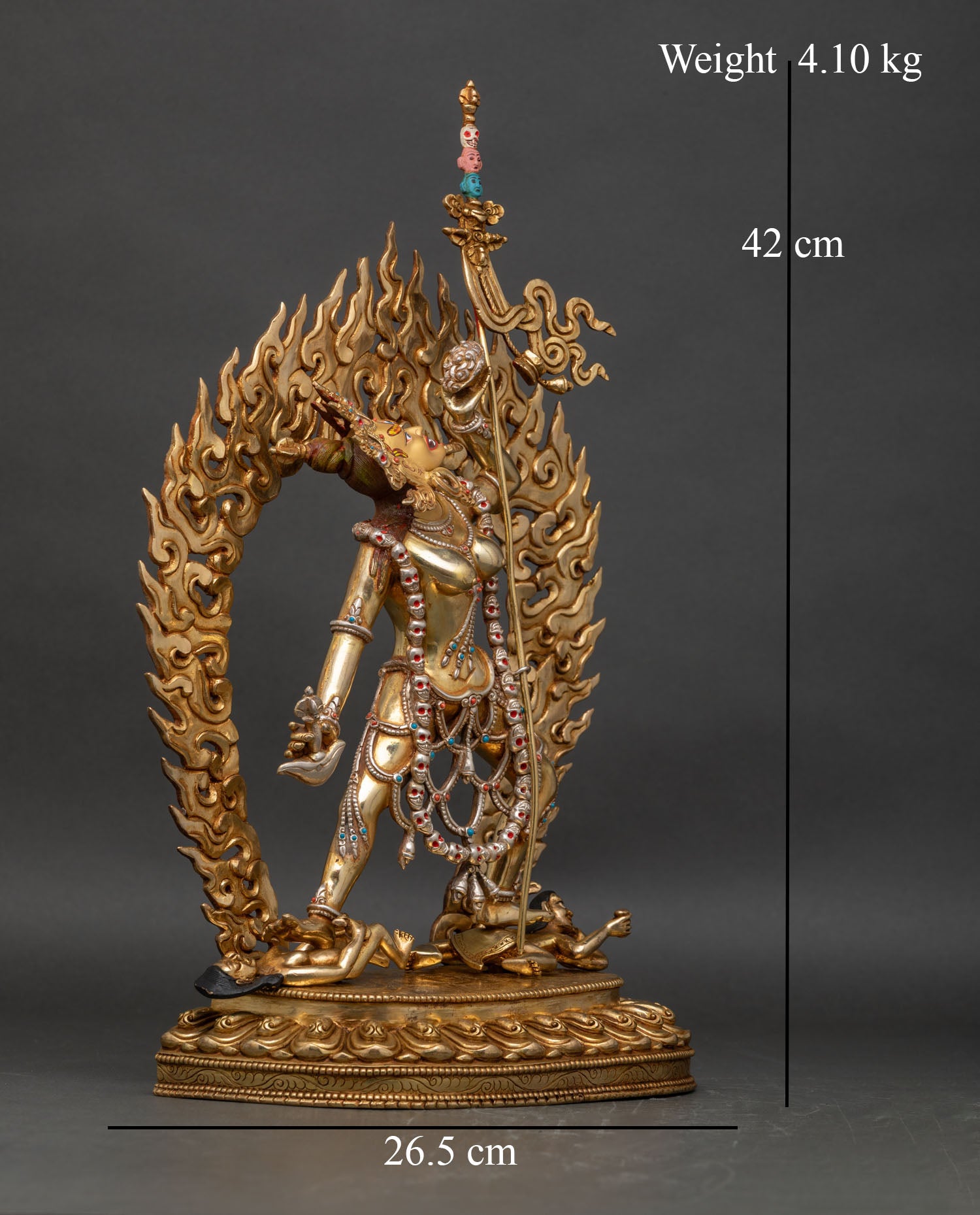 Right profile view of Vajrayogini statue, striding posture, kapala and khatvanga