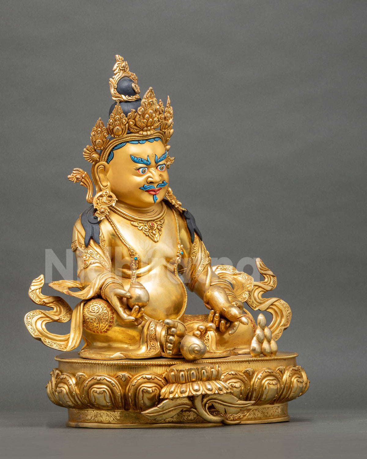 Right side profile view of lost-wax casted copper Yellow Dzambhala wealth deity sculpture.