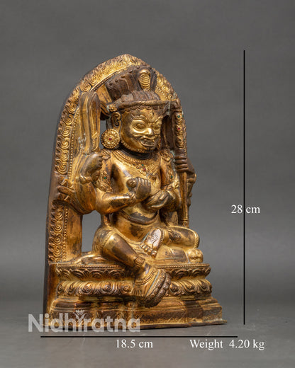 right-side-view chaturbhuja mahakala statue seated on lotus throne with sacred symbols