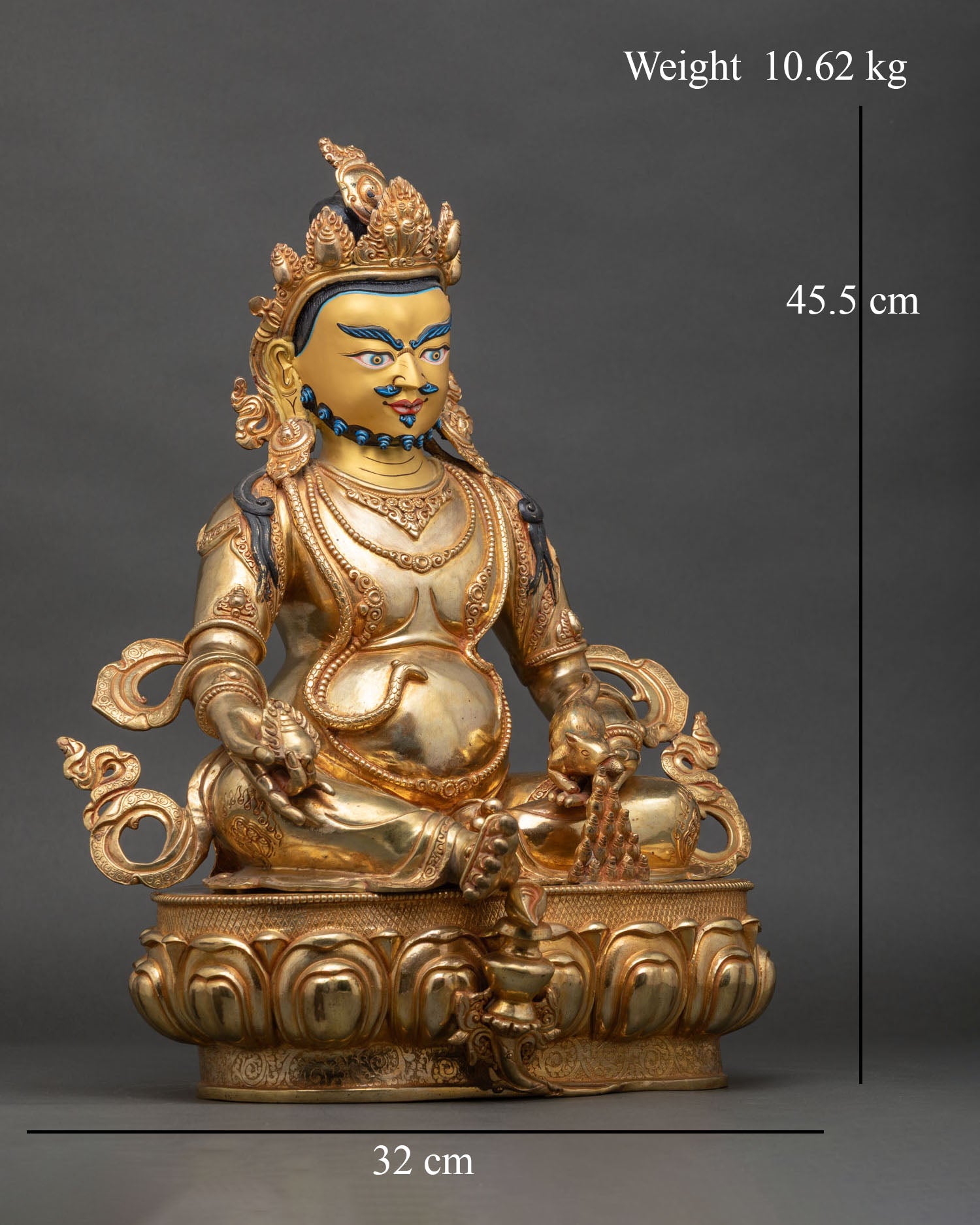 Right side view of Dzambhala Statue, copper and gold, holding jewel-spitting mongoose