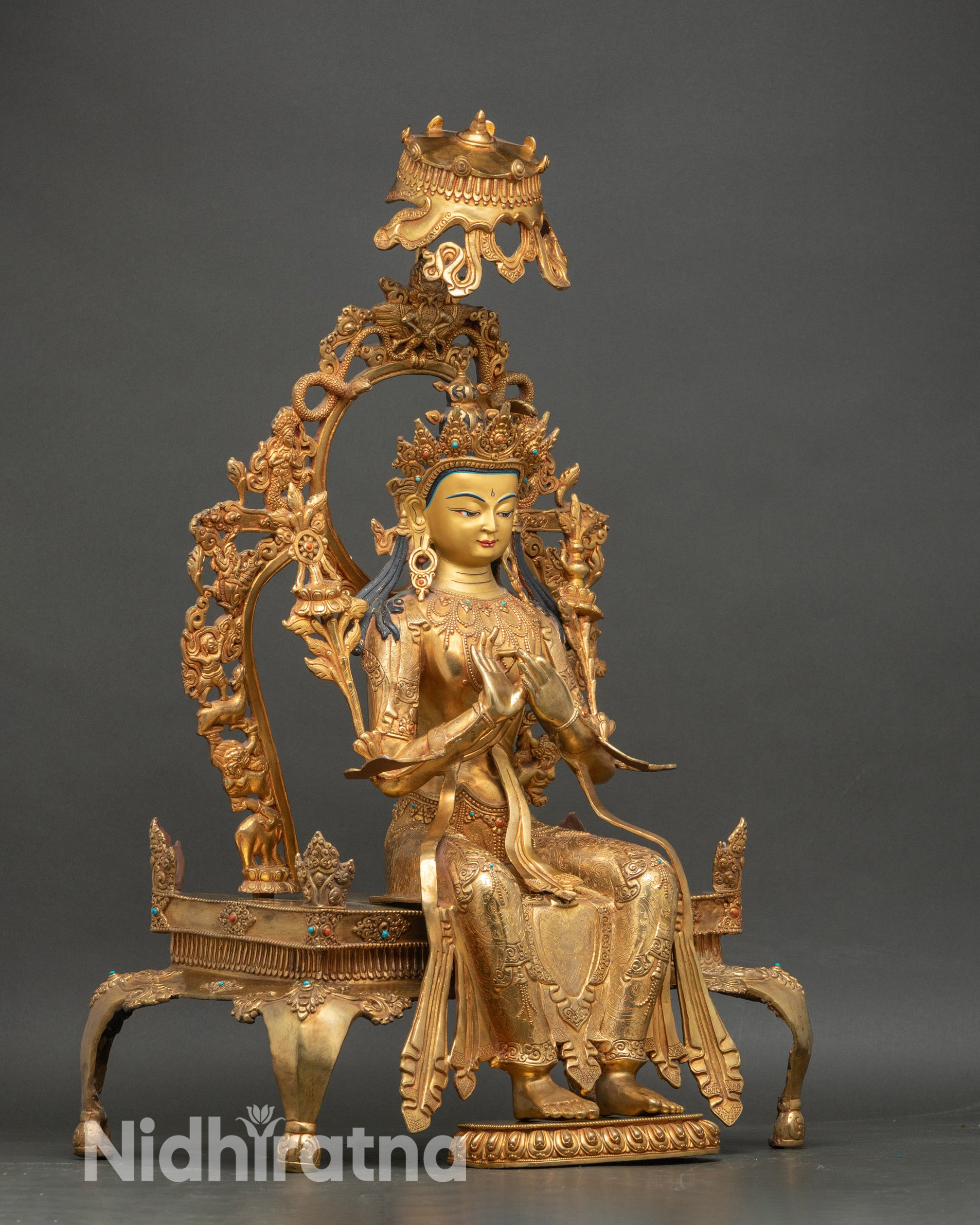 right side view of maitreya buddha statue, lotus base and throne details