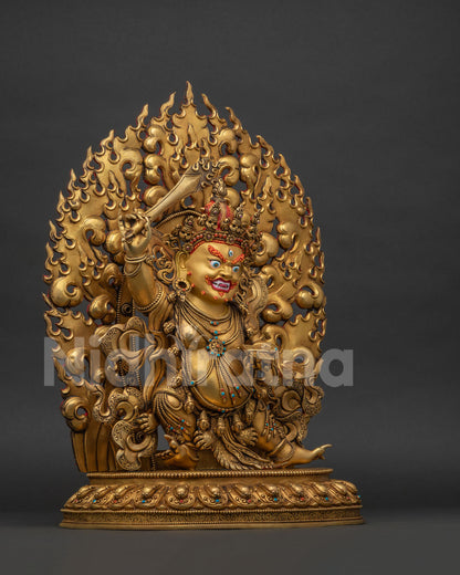 Right side view of Black Manjushri statue holding flaming double-edged sword