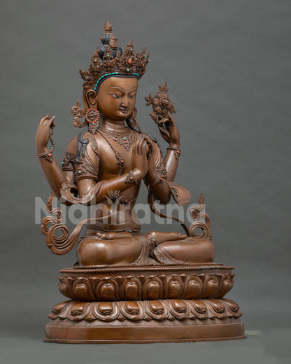 Right side view of Chenrezig statue showing crown, ornaments, and lotus stem