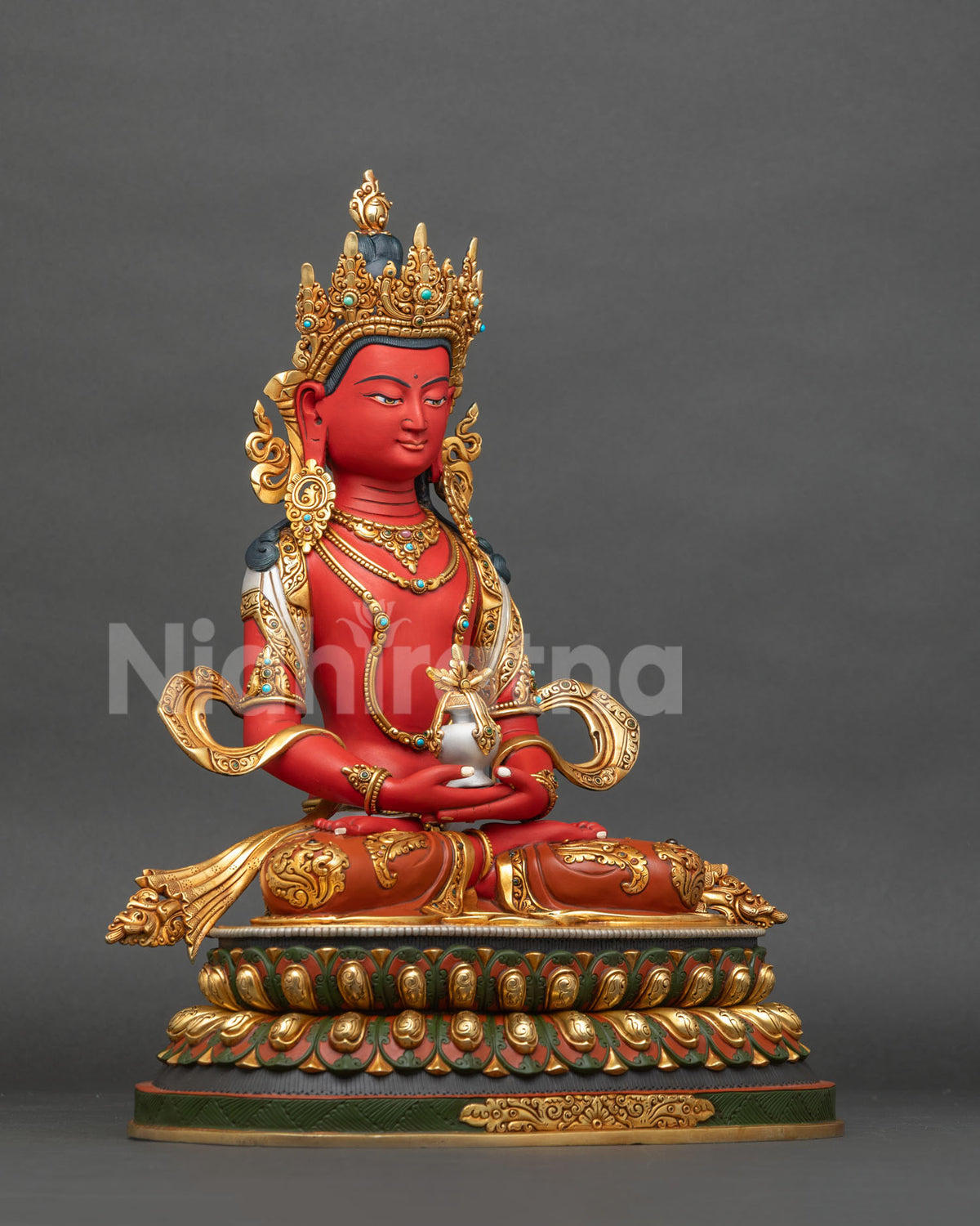 Right side view of copper Amitayus statue seated on a double lotus pedestal with gold gilding