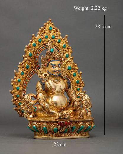 Right side view of Dzambhala wealth deity statue seated on lotus base with mongoose