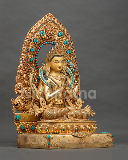 Right side view of four-armed Chenrezig statue holding crystal rosary and blooming lotus