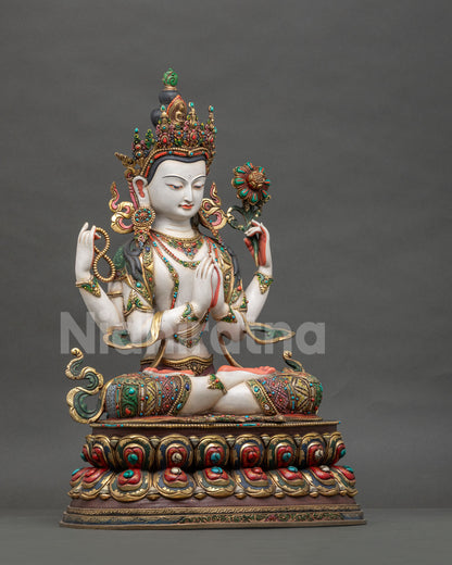 Right side view of four-armed copper Chenrezig statue from Nepal