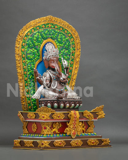 Right side view of Ganesha statue on lion throne with gold gilded backrest, handcrafted Nepali idol