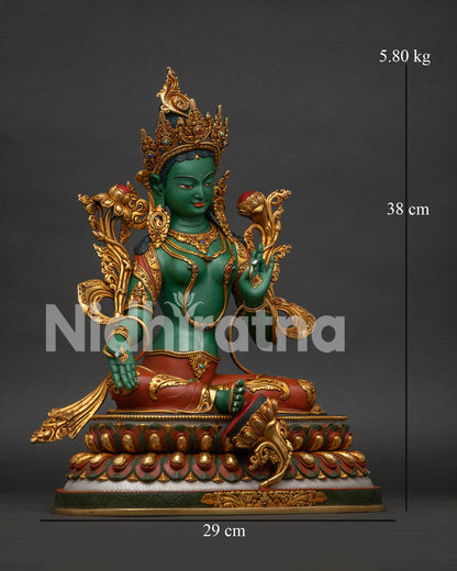 Right side view of gold-gilded Green Tara statue on double-lotus seat