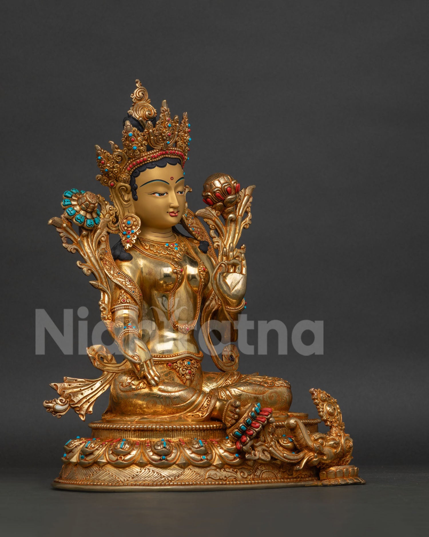 Right side view of gold-gilded Green Tara statue, Tibetan Buddhist art