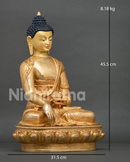 right side view of gold gilded shakyamuni buddha statue from nepal