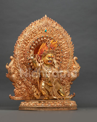 Right side view of gold gilded Vajrapani statue with blazing halo and lotus base, Himalayan art