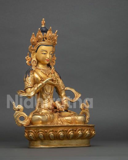 Right side view of gold gilded Vajrasattva statue seated on lotus base, Himalayan Buddhist sculpture