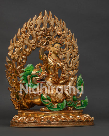 Right side view of gold Tseringma sculpture showing the snow lion mount and halo details
