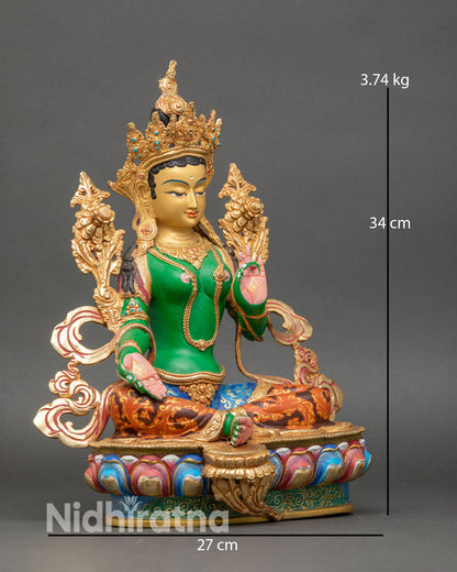 Right side view of Green Tara statue, hand-painted copper with gold-gilded robes and lotus base
