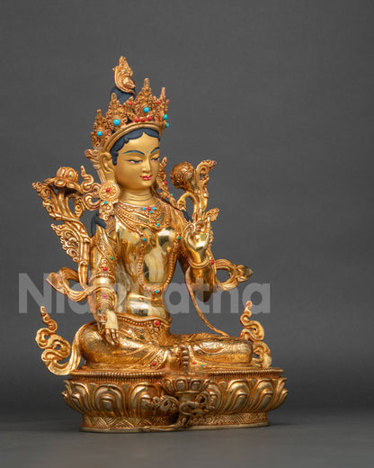 Right side view of Green Tara Statue seated in Lalitasana on lotus pedestal